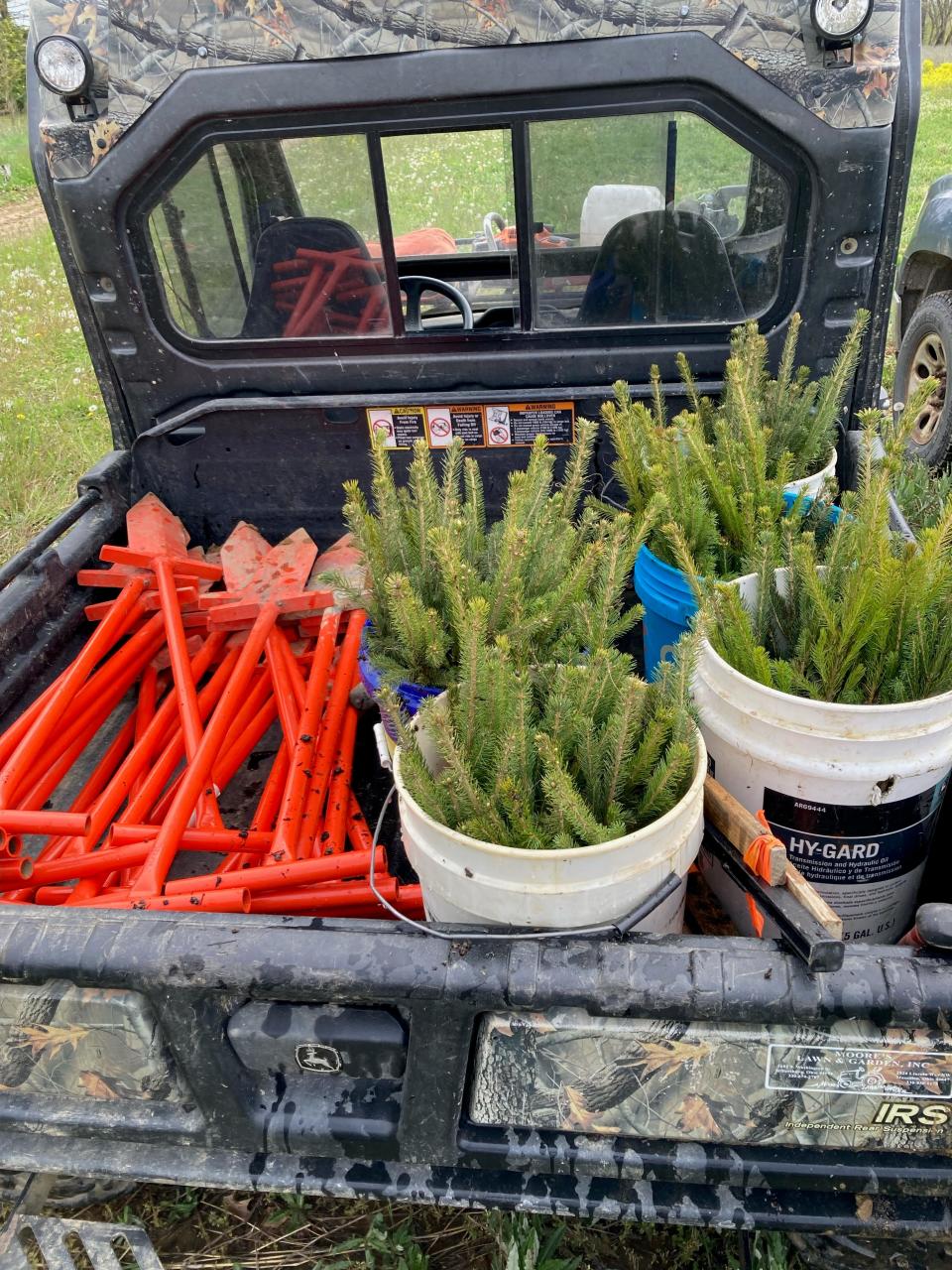 Dibble bars, tools used to open the ground to make room for tree planting, and Norway Spruce seedlings are ready for Edgewood Middle School seventh-graders to plant at the Killbuck Marsh Wildlife Area.