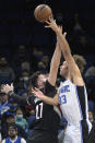 Orlando Magic center Robin Lopez (33) goes up to shoot in front of Portland Trail Blazers center Jusuf Nurkic (27) during the first half of an NBA basketball game, Monday, Jan. 17, 2022, in Orlando, Fla. (AP Photo/Phelan M. Ebenhack)