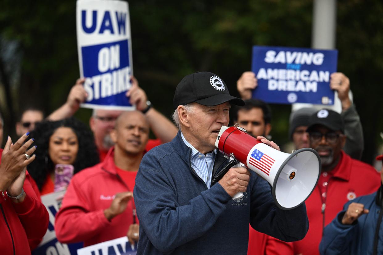 US President Joe Biden addresses striking members of the United Auto Workers (UAW) union at a picket line outside a General Motors Service Parts Operations plant in Belleville, Michigan, on September 26, 2023.