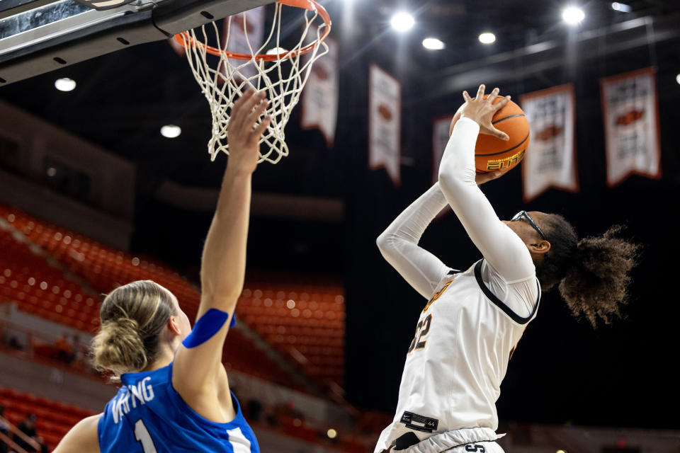 Jan 17, 2024; Stillwater, Okla, USA; Oklahoma State Cowgirls guard Stailee Heard (32) shoots over BYU Cougars guard Amari Whiting (1) in the first half of a womenÕs NCAA basketball game at Gallagher Iba Arena. Mandatory Credit: Mitch Alcala-The Oklahoman