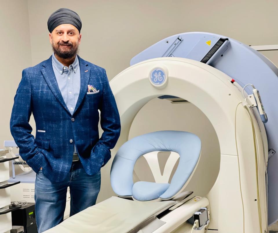 Calgary cardiologist, Dr. Anmol Kapoor, stands beside the machine used to take nuclear images during the procedure. 