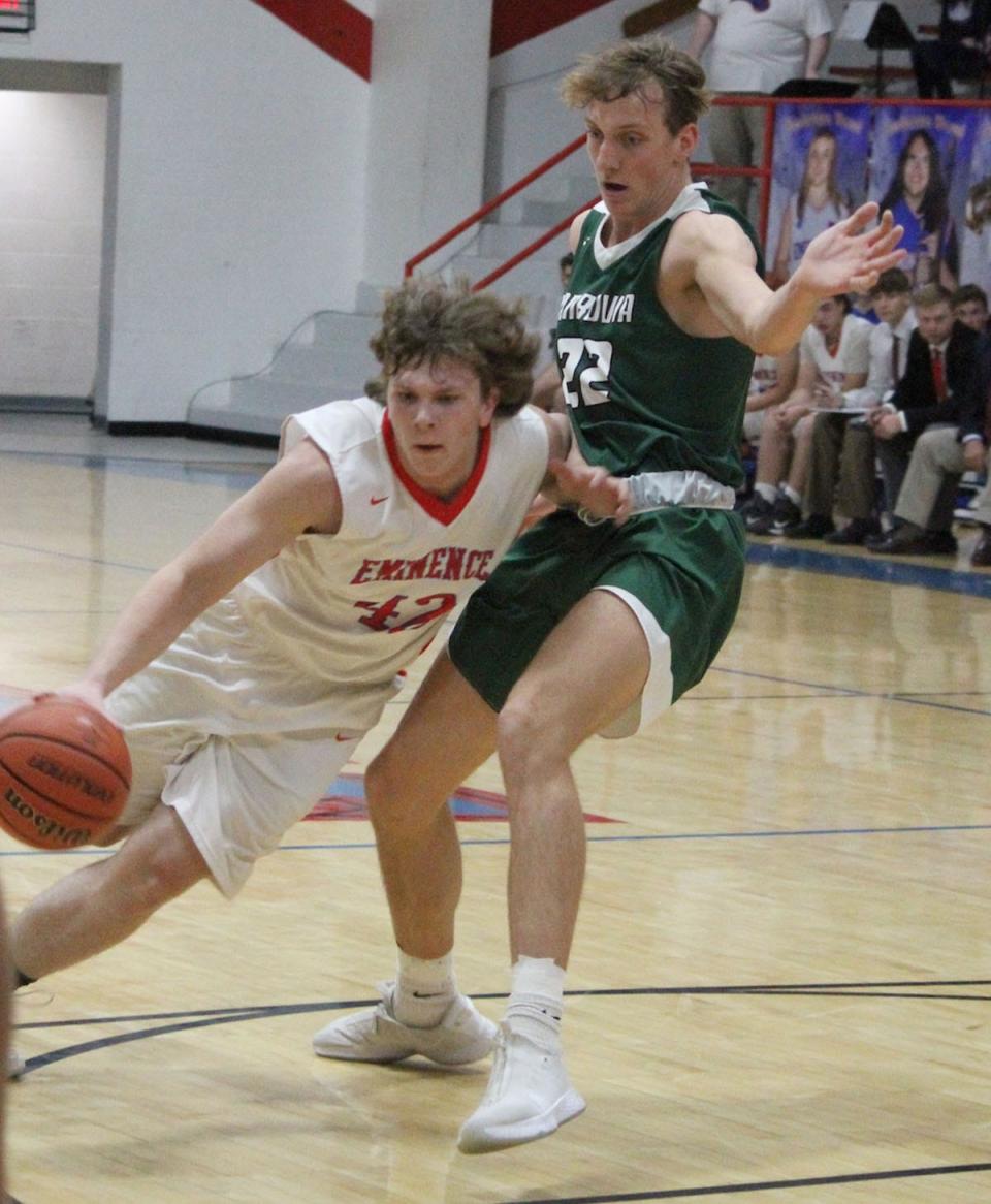 Eminence junior Evan Keeton (42) drives around Monrovia senior Austin Leeds (22) during Wednesday's Powder Keg game at Eminence. 