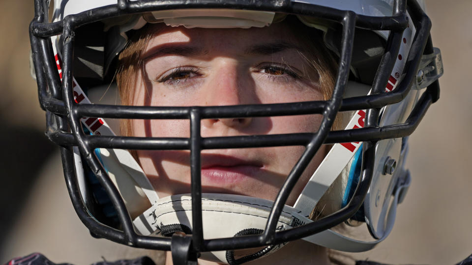 Sam Gordon poses for a photograph, Oct. 20, 2020, in Herriman, Utah. Gordon was the only girl in a tackle football league when she started playing the game at age 9. Now, Gordon hopes she can give girls a chance to play on female-only high school teams through a lawsuit. (AP Photo/Rick Bowmer)