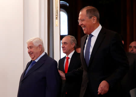 REFILE - CORRECTING BYLINE Russian Foreign Minister Sergei Lavrov and Syrian Foreign Minister Walid al-Moualem enter a hall for their talks in Moscow, Russia August 30, 2018. REUTERS/Maxim Shemetov