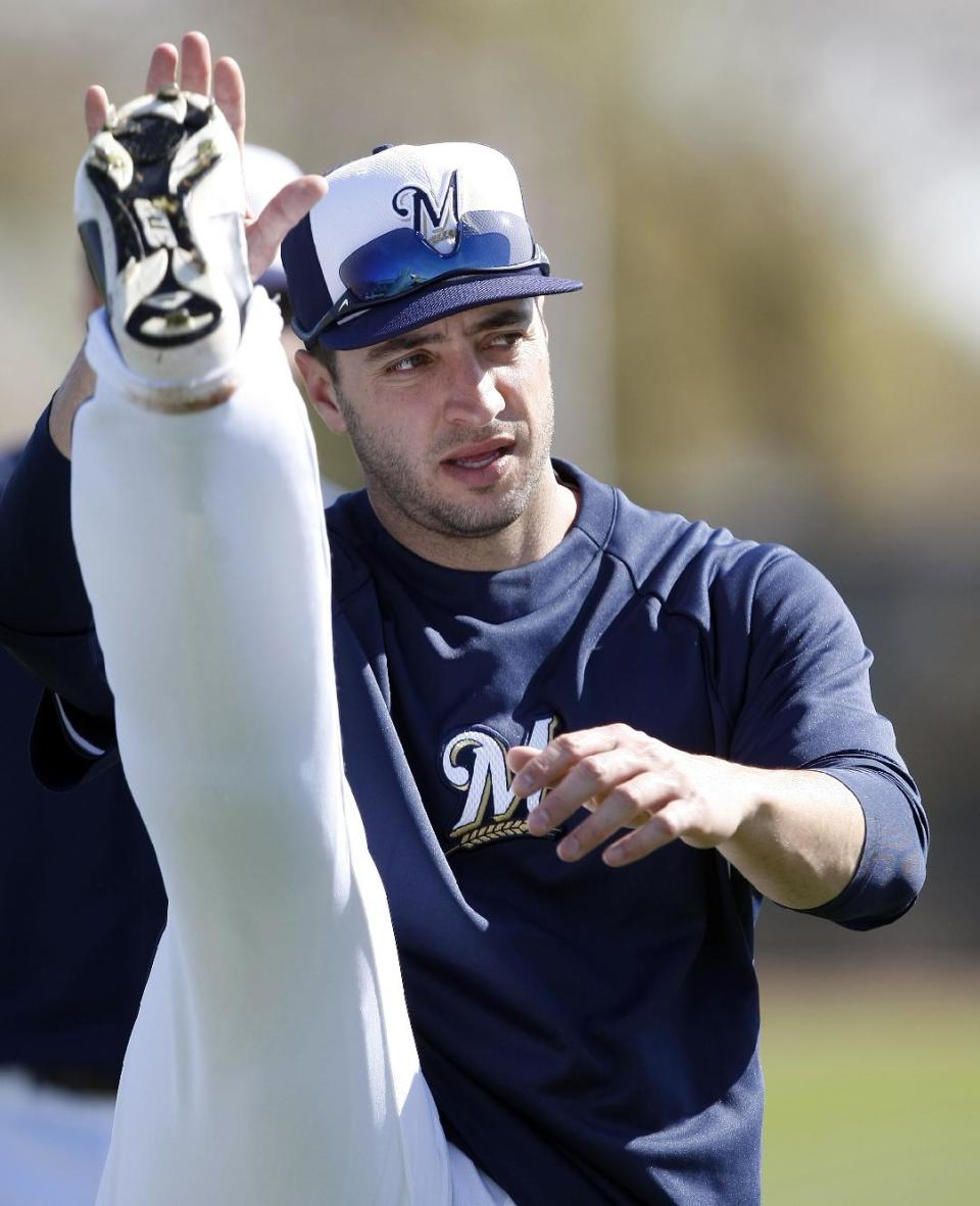 Milwaukee Brewers left fielder Ryan Braun (8) warms up during a spring training baseball practice, Sunday, Feb. 22, 2014, in Phoenix, Ariz. (AP Photo/Rick Scuteri)