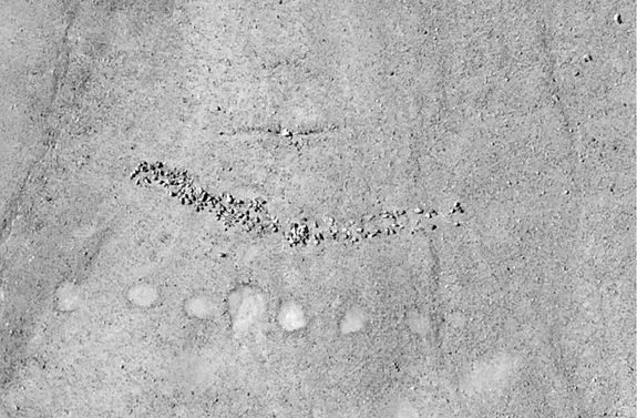 Aerial photographs of geoglyphs and rock cairns located in the pampa directly above Quilcapampa.