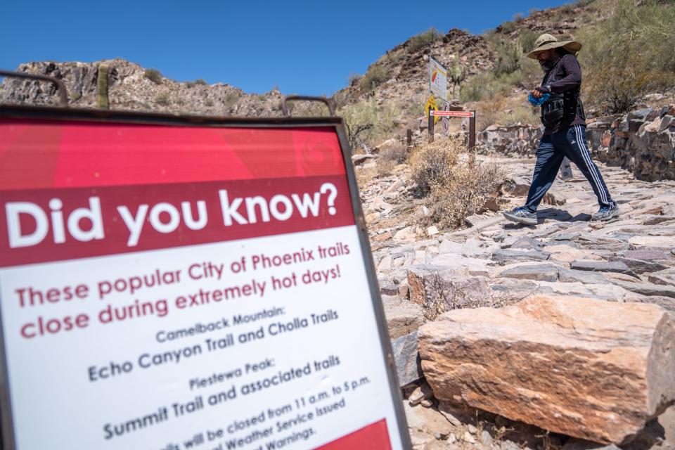 Odon Mendoza hikes in the Phoenix Mountains Preserve near Piestewa Peak in Phoenix on July 20, 2023.