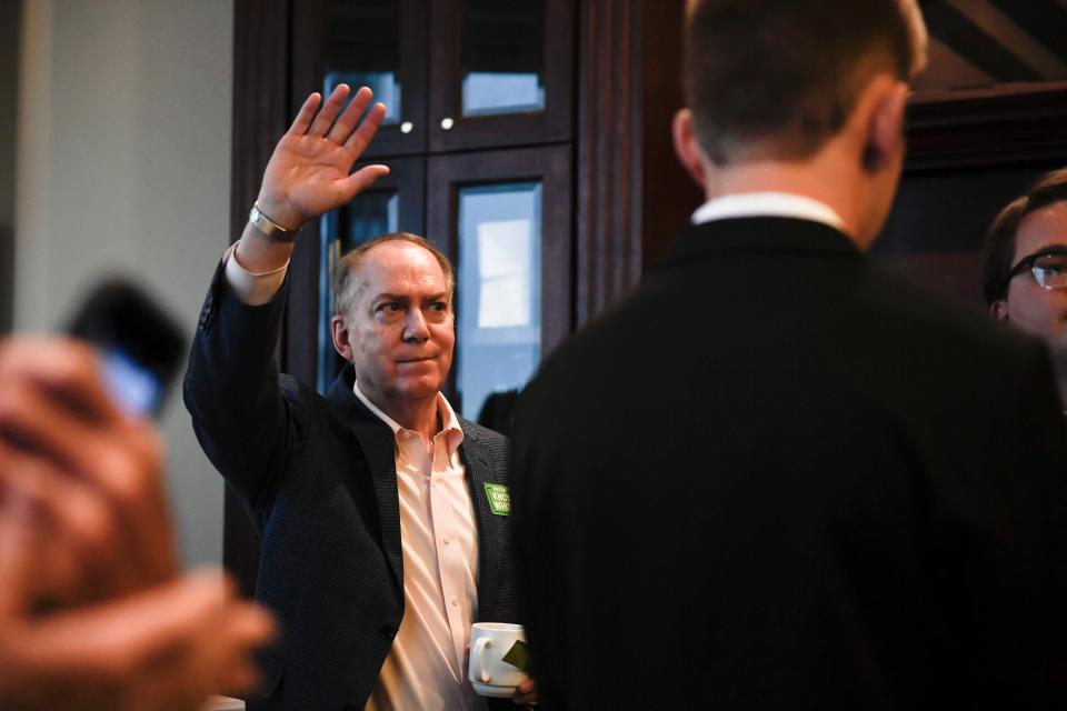 Greenville Mayor Knox White waves to a crowd before Sen. Tim Scott speaks at an event with Fourth District Republican Club at the Commerce Club in Greenville, S.C., on Friday, May 12, 2023.