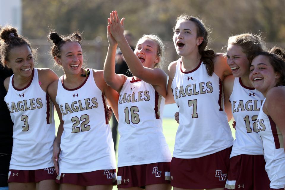 12. Fiona Isbell (left), Camille Gregory, Grace Cantwell, Molly Griffith, Sophia Schultheis and Ellie Pardi celebrate after the Watterson field hockey team defended its state title with a 2-1 overtime win over Thomas Worthington on Nov. 6.