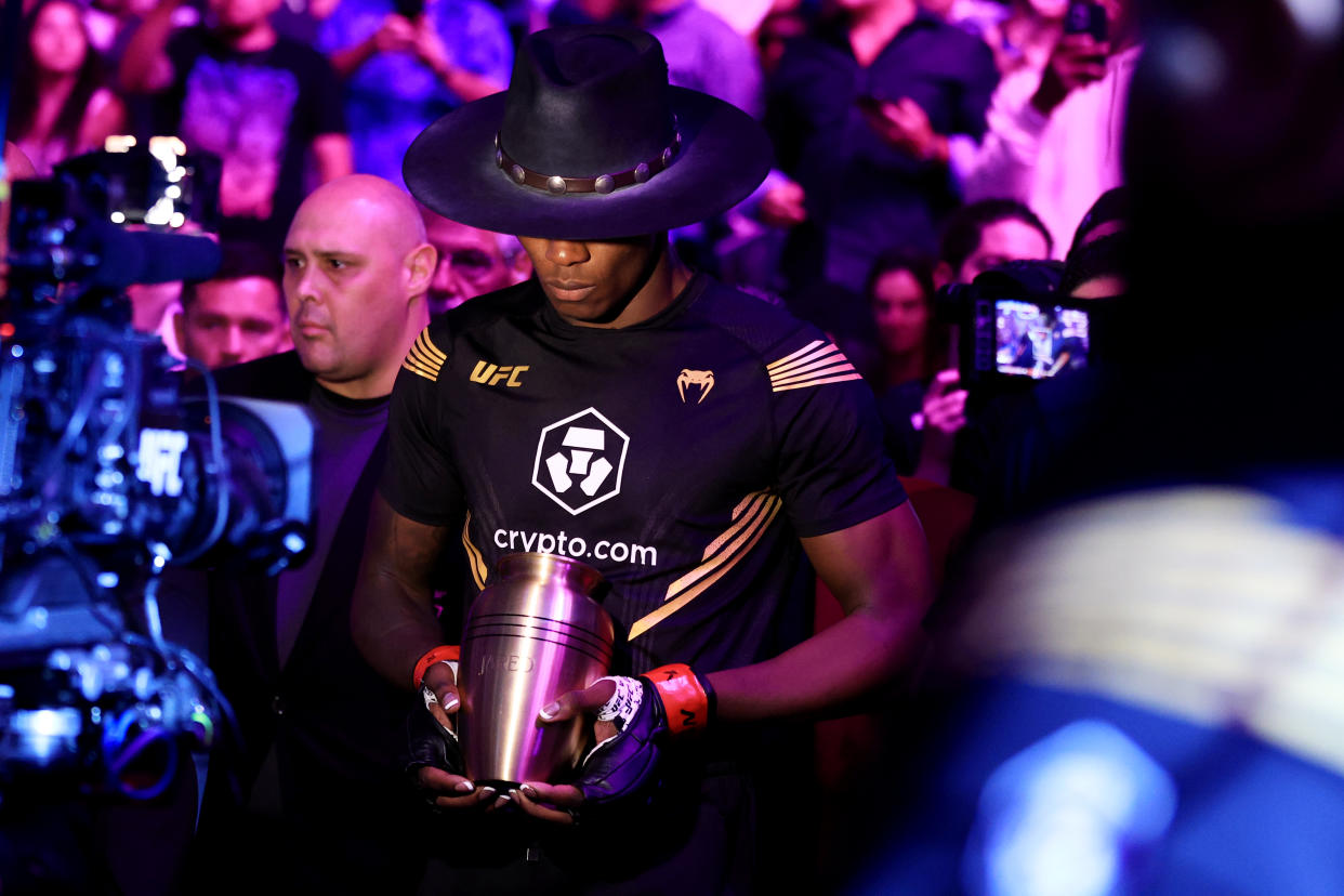 LAS VEGAS, NEVADA - JULY 02: Israel Adesanya of Nigeria prepares to enter the octagon for his middleweight title bout against Jared Cannonier during UFC 276 at T-Mobile Arena on July 02, 2022 in Las Vegas, Nevada. (Photo by Carmen Mandato/Getty Images)