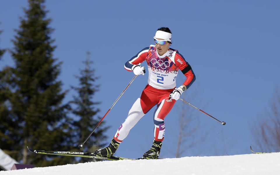 Norway's gold medal winner Marit Bjoergen skis during the women's cross-country 15k skiathlon at the 2014 Winter Olympics, Saturday, Feb. 8, 2014, in Krasnaya Polyana, Russia. (AP Photo/Lee Jin-man)