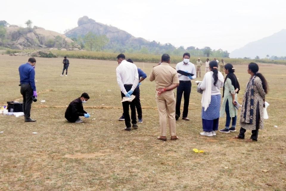 Indian police and forensic team examine and collect samples at the site where a Spanish tourist was raped, near Kurmahaat, Dumka (EPA)