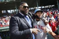 Former Boston Red Sox player David Ortiz, left, stands with Dominican rapper El Alfa El Jefe, right, before a baseball game between the Red Sox and the Washington Nationals, Saturday, May 11, 2024, in Boston. (AP Photo/Michael Dwyer)