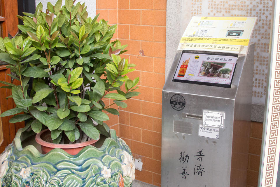 The keeper of my fate — Wong Tai Sin temple's fortune s-Stick reader.