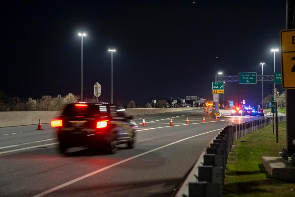 Police close the stretch of I-695 on the north end of the Key Bridge.The Francis Scott Key Bridge, a major span over the Patapsco River in Baltimore, collapsed after it was struck by a Singapore-flagged container ship 'Dali'. The cargo ship collided with a pillar of the bridge, prompting a massive emergency response for multiple people in the water. The Baltimore City Fire Department described the collapse as a mass-casualty incident.