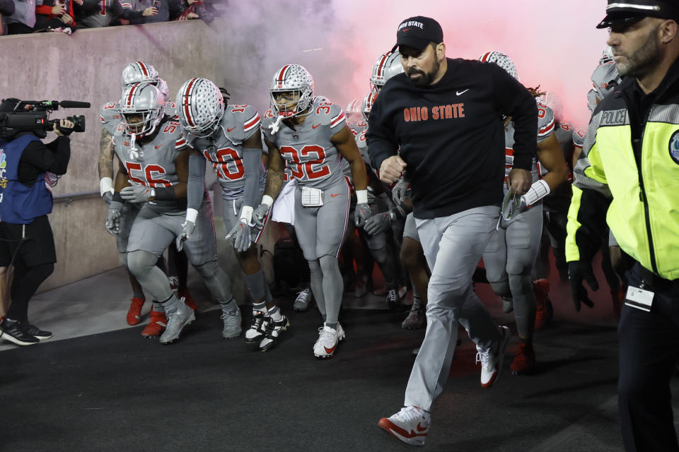 Ohio State coach Ryan Day leads the team onto the field for an NCAA college football game against Michigan State on Saturday, Nov. 11, 2023, in Columbus, Ohio. (AP Photo/Jay LaPrete)