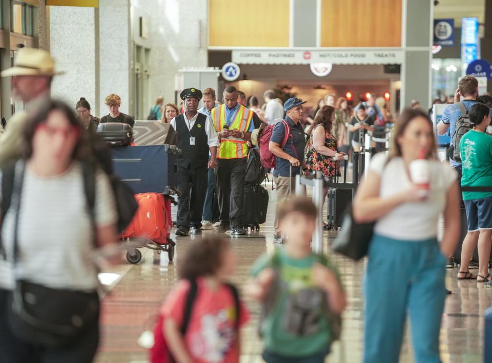 Travelers pack Austin-Bergstrom International Airport on June 30. The summer travel season comes at a time when long lines and flight delays have often plagued the airport.