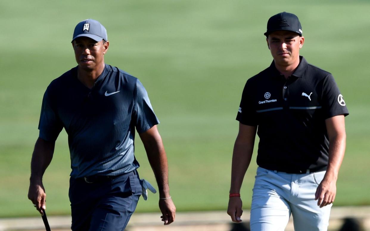 Tiger Woods and Rickie Fowler walk to the 11th green during the second round of The Players Championship golf tournament at TPC Sawgrass - Stadium Course - Adam Hagy-USA TODAY 