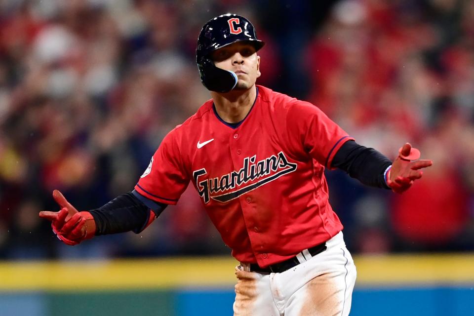 Cleveland Guardians' Andres Gimenez gestures from second base after hitting a single and advancing to second on a fielding error by New York Yankees' Harrison Bader in the seventh inning of Game 4 of a baseball AL Division Series, Sunday, Oct. 16, 2022, in Cleveland. (AP Photo/David Dermer)