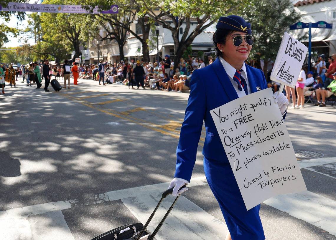 An unidentified parader mocks the DeSantis’ migrant flights as she portrays a flight attendant of DeSantis Airlines. The 39th Annual King Mango Strut, Coconut Grove’s famous and most iconic satirical parade, took place on Sunday, January 8, 2023 to kick off the month-long celebration of the 150th Anniversary of the founding of Coconut Grove. This year’s theme, “The Queen is Dead, Long Live the King,” honors the reign of a new era and a renaissance for this special event focusing on inclusivity, acceptance and fun.