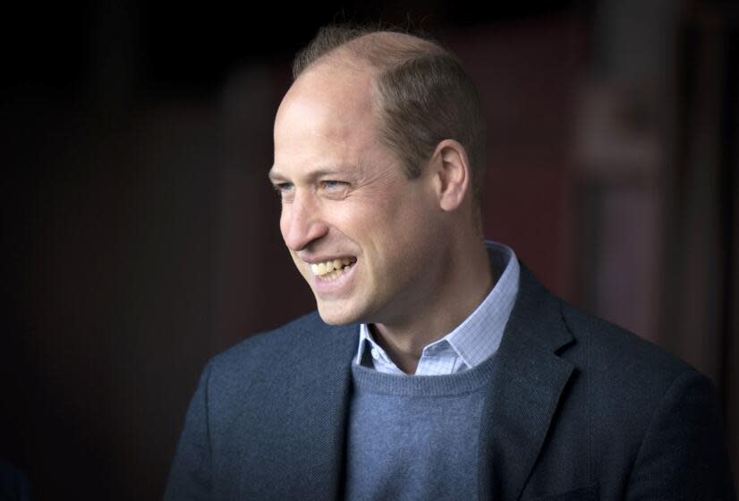 FILE - Britain's Prince William visits at the Heart of Midlothian Football Club, in Edinburgh, Scotland, Thursday May 12, 2022. The world watched as Prince William grew from a towheaded schoolboy to a dashing air-sea rescue pilot to a father of three. But as he turns 40 on Tuesday, June 21, 2022, William is making the biggest change yet: assuming an increasingly central role in the royal family as he prepares for his eventual accession to the throne. (Jane Barlow/Pool Photo via AP, File)