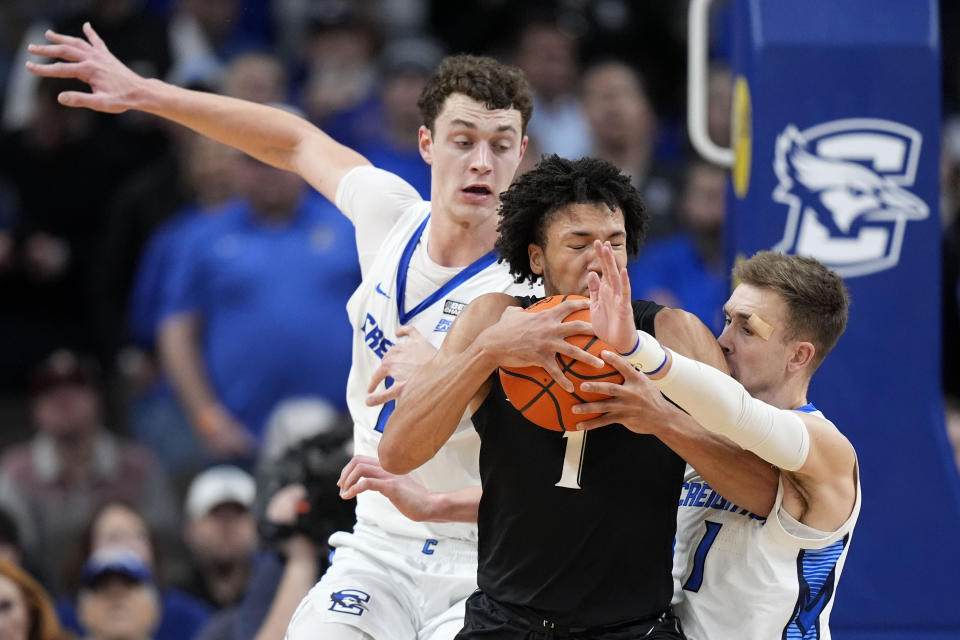 Creighton guard Steven Ashworth, right, tries to steal the ball from Xavier guard Desmond Claude during the first half of an NCAA college basketball game, Tuesday, Jan. 23, 2024, in Omaha, Neb. (AP Photo/Charlie Neibergall)