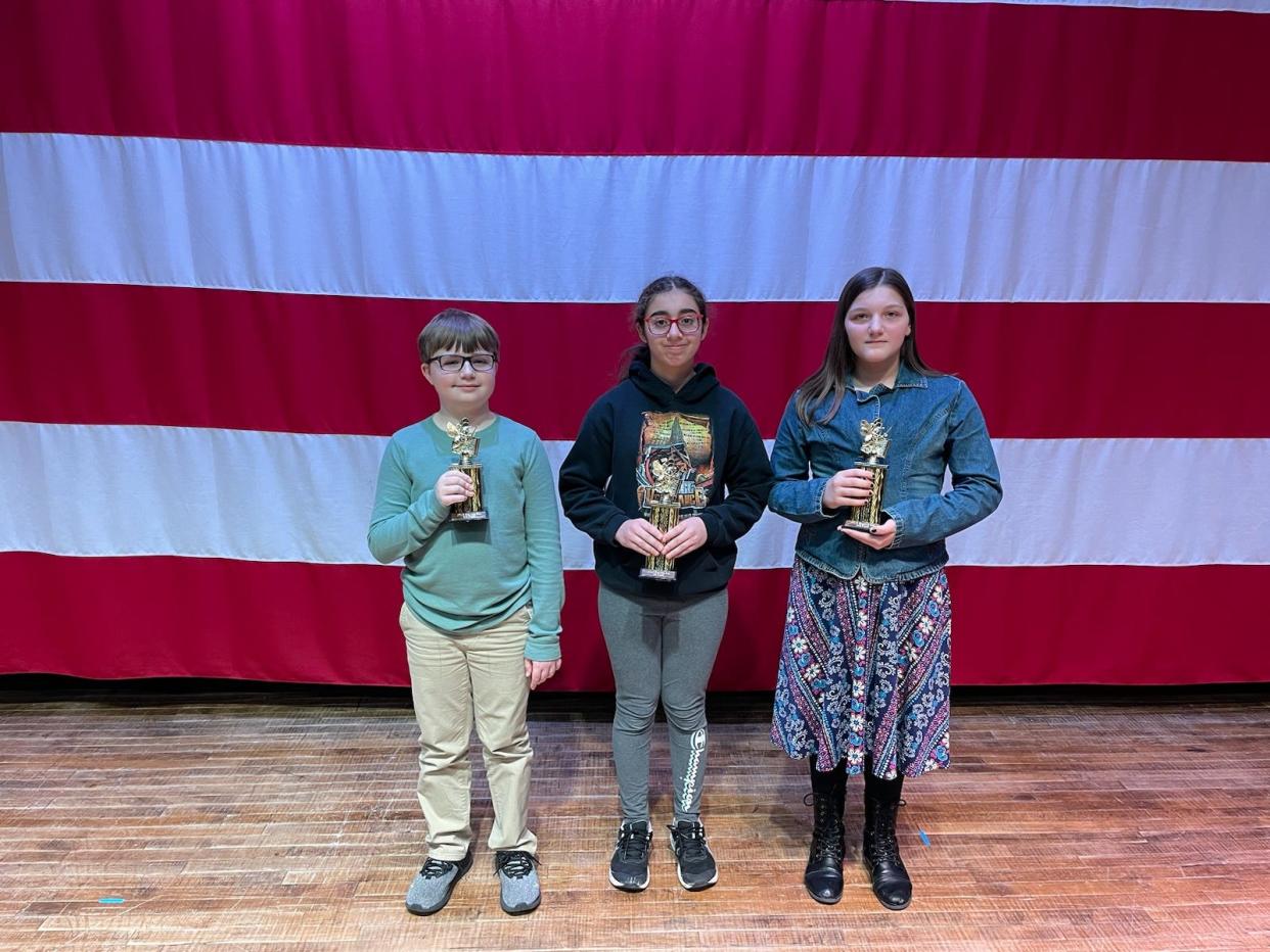 Spelling Bee winners at Port Clinton Middle School  are, left to right, third place, Maxon Fluckinger; first place,  Shantha Weit; and second place, Nayellie Fritz.