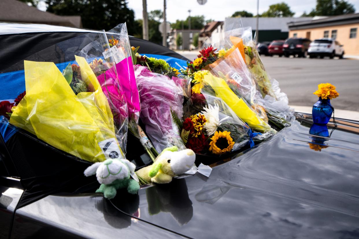 A memorial is set up outside the Kossuth County Law Enforcement Center after the Wednesday night death of Algona police officer Kevin Cram on Thursday, September 14, 2023 in Algona.