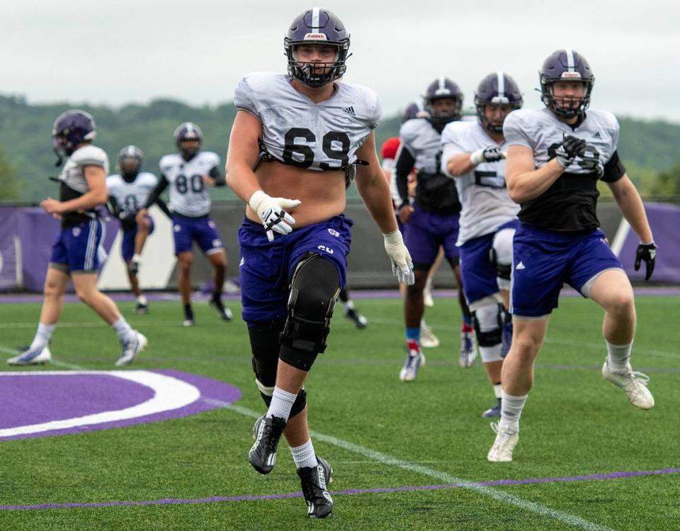 Holy Cross offensive lineman CJ Hanson runs through a drill during a 2023 practice.