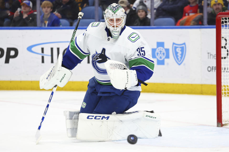 Vancouver Canucks goaltender Thatcher Demko (35) watches the puck go wide during the first period of an NHL hockey game against the Buffalo Sabres, Saturday, Jan. 13, 2024, in Buffalo, N.Y. (AP Photo/Jeffrey T. Barnes)