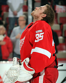 Veteran Wings goalie Chris Osgood passed the torch to Howard