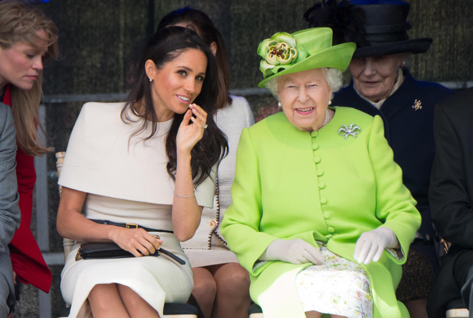 Queen Elizabeth ll and Meghan, Duchess of Sussex open the New Mersey Gateway Bridge during a visit to Cheshire on June 14, 2018.  This is the Duchess's first solo engagement with The Queen