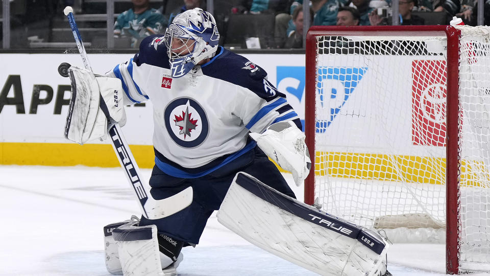 Will Connor Hellebuyck find himself in a new NHL jersey to start next season? (AP Photo/Tony Avelar)