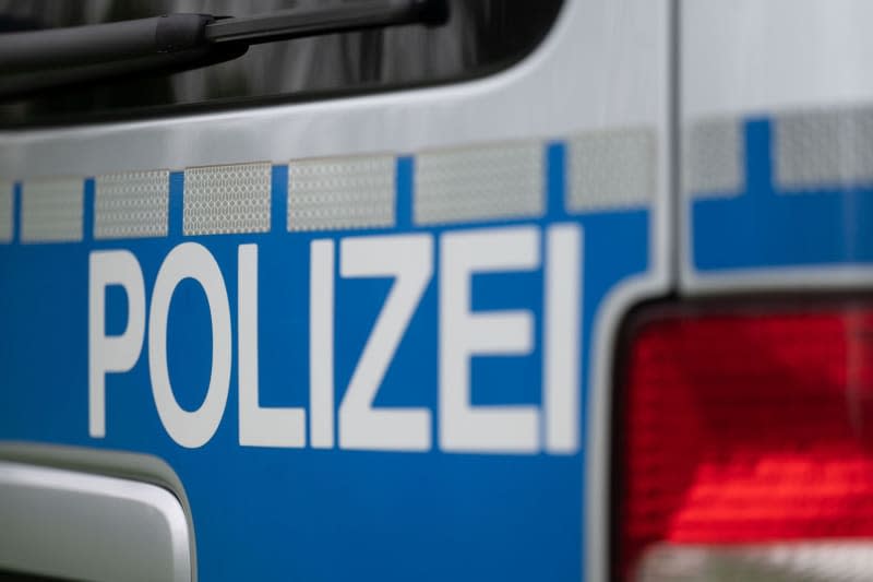 The word police can be seen on a police vehicle. Marijan Murat/dpa