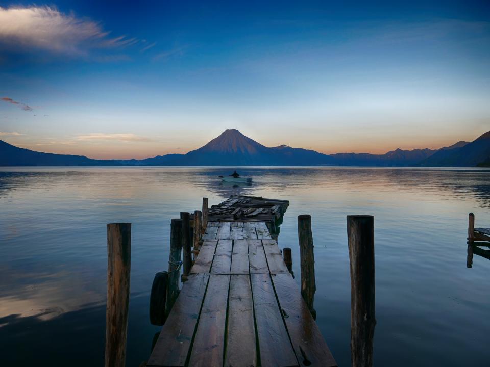 A view of the lake with volcanoes in the background in Panajachel, Guatemala