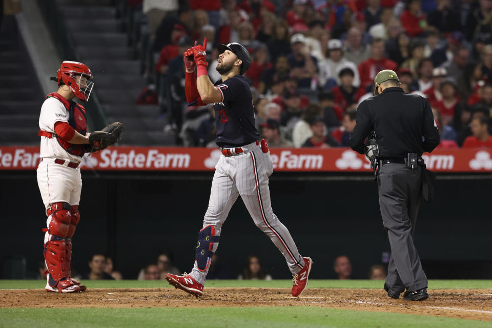 Minnesota Twins first baseman Joey Gallo (13) gestures after hitting a home run during the sixth inning of a baseball game against the Los Angeles Angels in Anaheim, Calif., Saturday, May 20, 2023. (AP Photo/Jessie Alcheh)