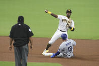 CORRECTS TO PADRES' JORGE MATEO NOT JURICKSON PROFAR - San Diego Padres second baseman Jorge Mateo, top right, attempts to turn a double play as Los Angeles Dodgers' Max Muncy, bottom right, slides into second in the fourth inning of a baseball game Monday, Sept. 14, 2020, in San Diego. Dodgers' Cody Bellinger was safe at first on the play. (AP Photo/Derrick Tuskan)