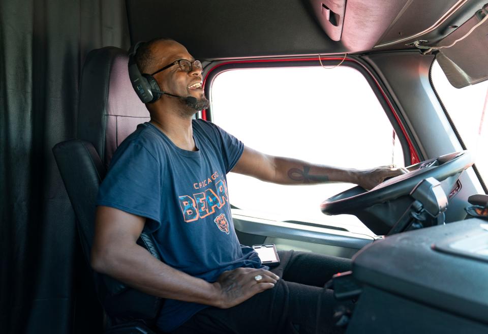 Truck driver Demetrius Harris Sr., of Chicago, rests in his rig at the Florida Turnpike service plaza on March 11, 2024 in West Palm Beach, Florida.