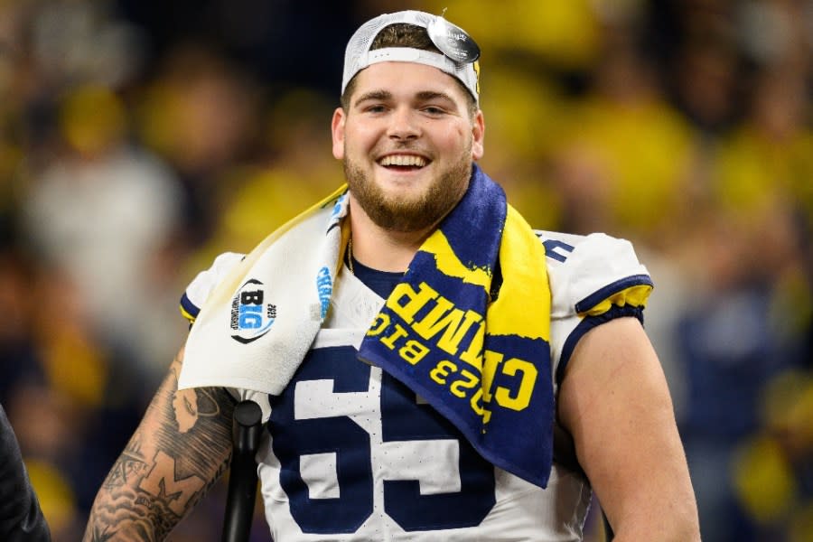 INDIANAPOLIS, IN - DECEMBER 02: Michigan Wolverines offensive lineman Zak Zinter (65) celebrates after the Big 10 Championship game between the Michigan Wolverines and Iowa Hawkeyes on December 2, 2023, at Lucas Oil Stadium in Indianapolis, IN. (Photo by Zach Bolinger/Icon Sportswire via Getty Images)
