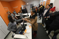 Illinois Lt. Gov. Juliana Stratton purchases recreational marijuana at Sunnyside dispensary Wednesday, Jan. 1, 2020, in Chicago. (AP Photo/Paul Beaty)