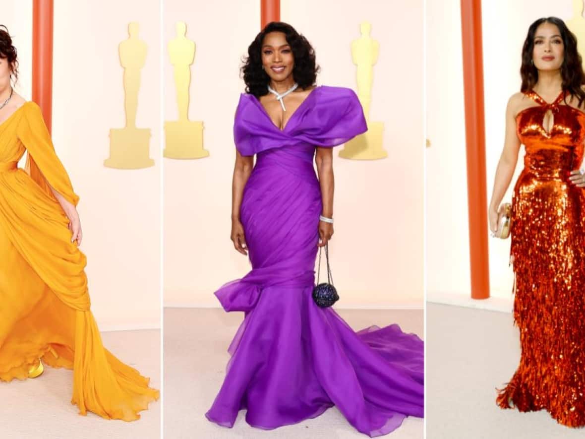 Sandra Oh, Angela Bassett and Salma Hayek, left to right, walk the champagne carpet at the 95th Academy Awards on Sunday in Los Angeles. (Getty Images - image credit)