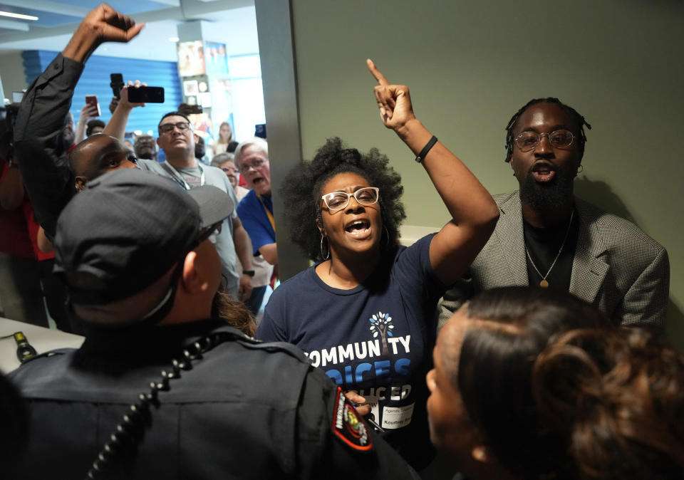 Kourtney Revels criticizes the Houston Independent School District School Board meeting limiting only 25 public participants while trying to get into the auditorium, which has a 310 capacity, on Thursday, June 15, 2023, at Hattie Mae White Educational Support Center in Houston. The board meeting changed the format and limited the participants for their second meeting. Revels was a registered speaker and was asked to sit in an overflow room separated from the board meeting. (Yi-Chin Lee/Houston Chronicle via AP)