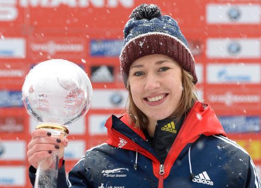 Britain's Lizzy Yarnold celebrates after winning the skeleton World Cup final in Schoenau, southern Germany, on January 24, 2014