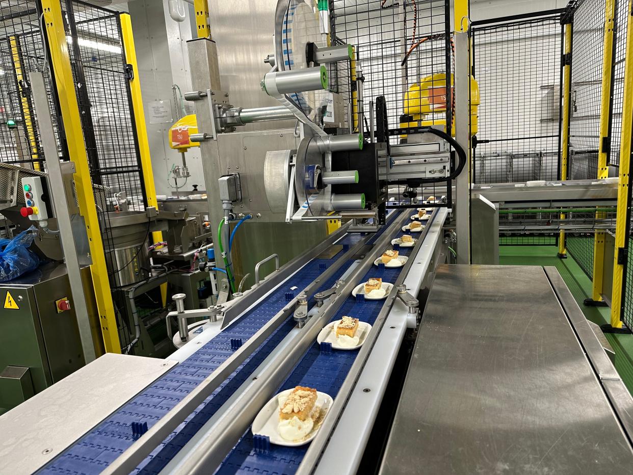 Slices of pie awaiting their turn with the placement robot.