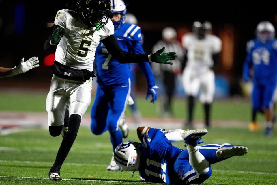 Wyoming defensive back Chazz Early (11) intercepts a pass intended for Taft's Jay’Quan Bostic (5) in the fourth quarter of the OHSAA DIV regional final Saturday.