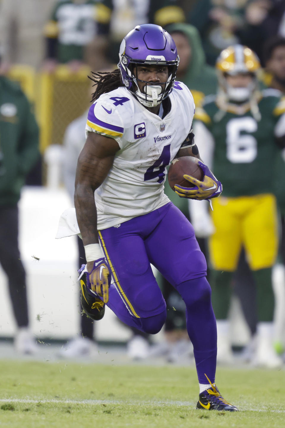 FILE - Minnesota Vikings running back Dalvin Cook (4) rushes during an NFL football game against the Green Bay Packers Sunday, Jan. 1, 2023, in Green Bay, Wis. DeAndre Hopkins and Dalvin Cook lead a list of accomplished players who are still available a week before several NFL teams open training camp. (AP Photo/Matt Ludtke, File)