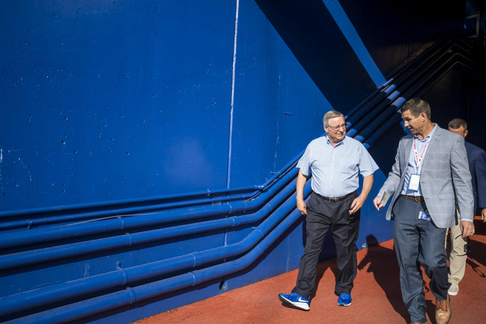 Buffalo Bills owner Terry Pegula (left) walks with assistant general manager Joe Schoen (right), who is expected to be named the New York Giants&#39; next general manager. (Photo by Brett Carlsen/Getty Images)