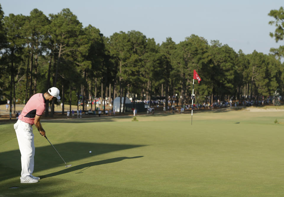 FILE - Martin Kaymer, of Germany, putts on the 13th hole during the third round of the U.S. Open golf tournament in Pinehurst, N.C., Saturday, June 14, 2014. The U.S. Open returns to Pinehurst on June 13-16, 2024. The course is renowned for its sandy dunes and turtleback greens. (AP Photo/Chuck Burton, File)