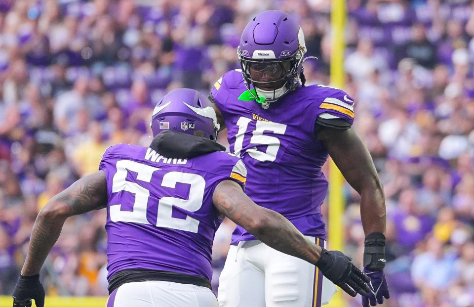 Aug 10, 2024; Minneapolis, Minnesota, USA; Minnesota Vikings linebacker Dallas Turner (15) celebrates his sack with linebacker Jihad Ward (52) against the Las Vegas Raiders in the first quarter at U.S. Bank Stadium. Mandatory Credit: Brad Rempel-USA TODAY Sports