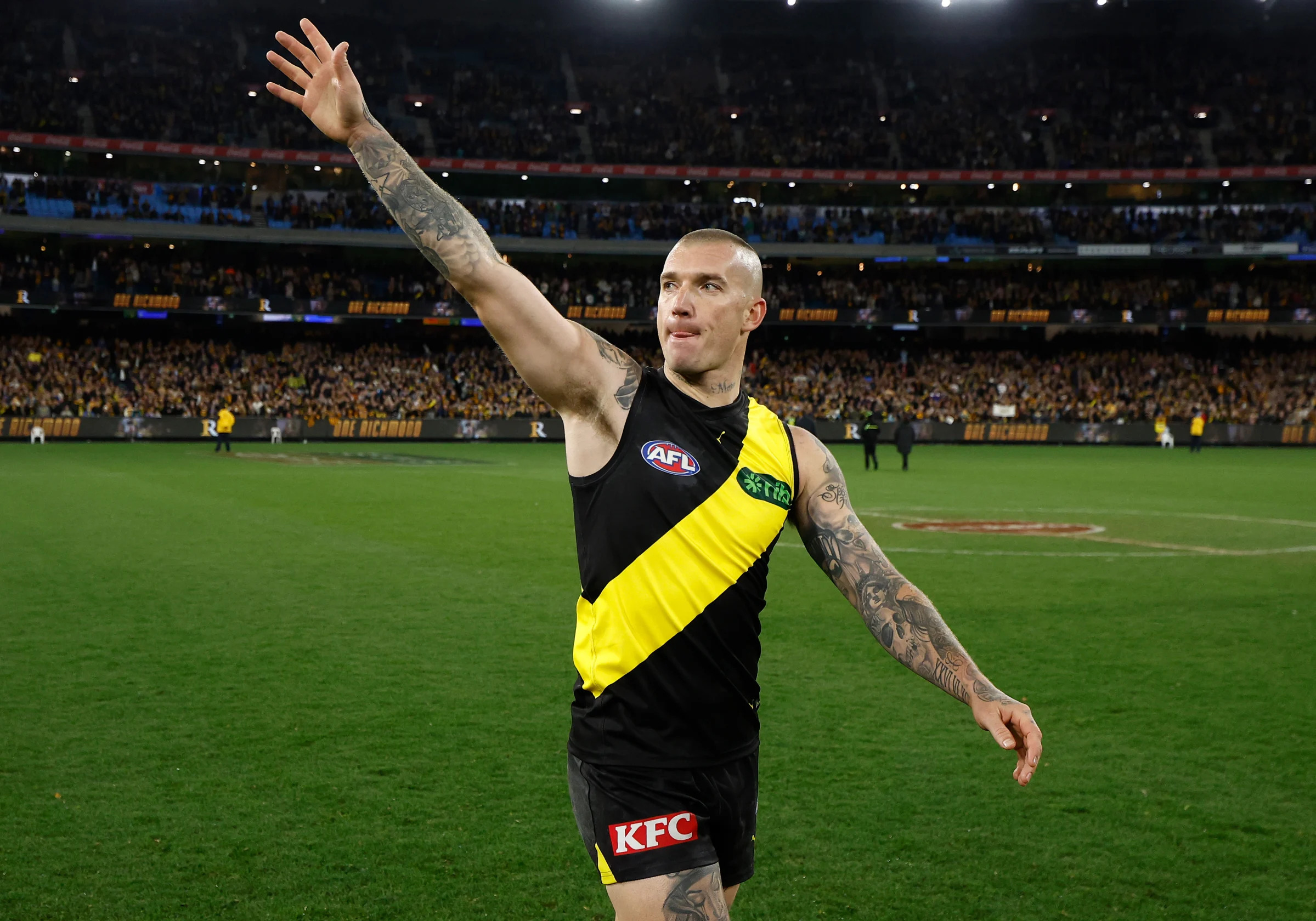 MELBOURNE, AUSTRALIA - JUNE 15: Dustin Martin of the Tigers recognises the crowd after his 300th match during the 2024 AFL Round 14 match between the Richmond Tigers and the Hawthorn Hawks at The Melbourne Cricket Ground on June 15, 2024 in Melbourne, Australia. (Photo by Michael Willson/AFL Photos via Getty Images)